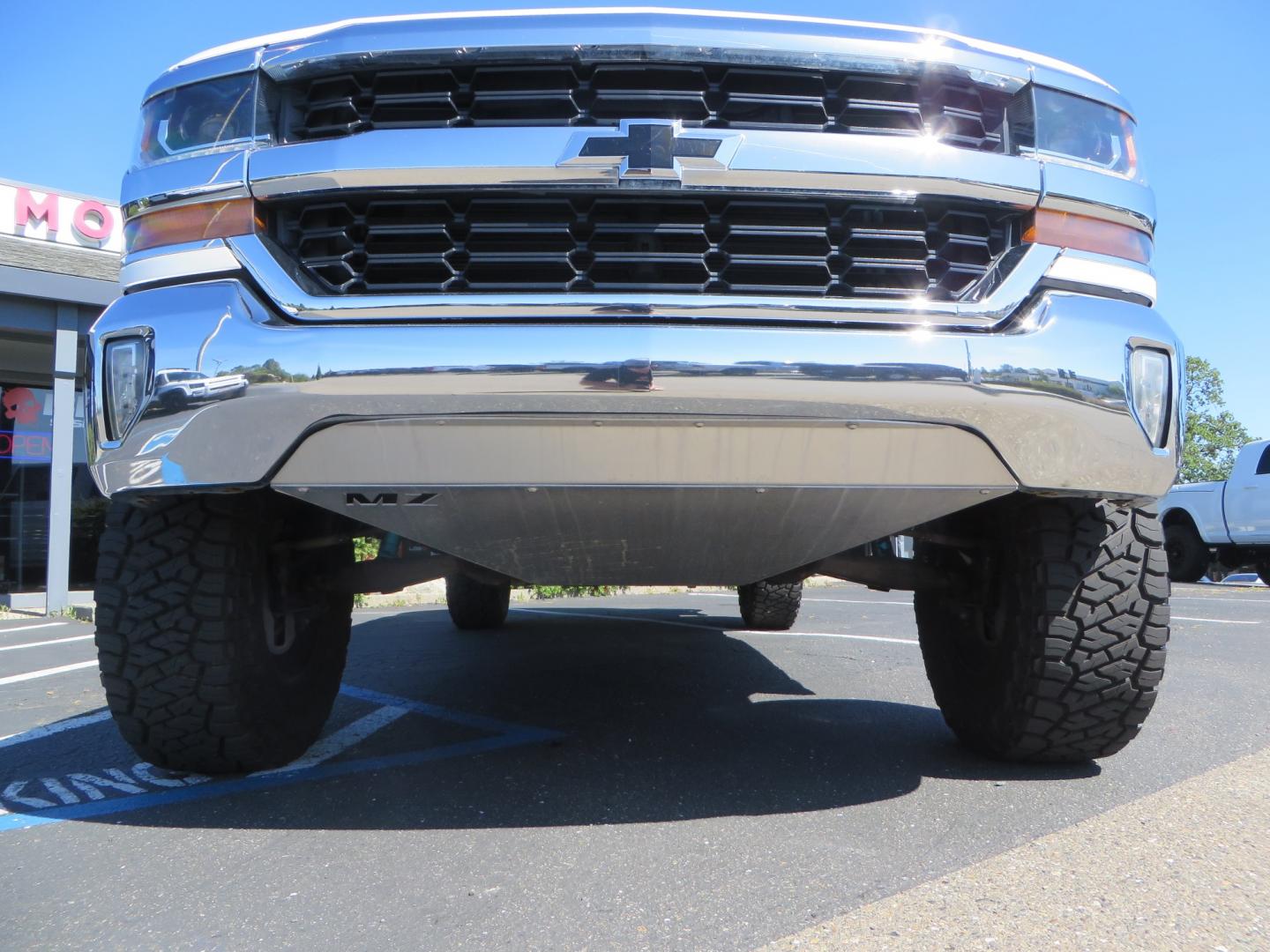 2018 White /BLACK Chevrolet Silverado 1500 LT (3GCPCREC7JG) with an 5.3L V8 OHV 16V engine, automatic transmission, located at 2630 Grass Valley Highway, Auburn, CA, 95603, (530) 508-5100, 38.937893, -121.095482 - Must see Pre Runner.... CST front lift spindals, Camburg UCA's, King Adjustable 2.5 Coil-overs, King 2.5 rear shocks, 35" Toyo RT Trail tires, 17" Method Race wheels, MZ front skid plate, G2 rear differntail cover, Full size bed mounted spare tire, Black Vinyl roof wrap, smoke tail lights and 3rd br - Photo#11